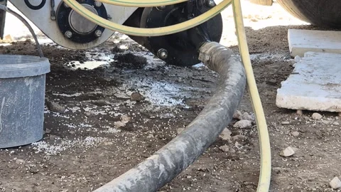 Slow Motion Close Up of Pulsing Flexible Concrete Hose Stock Footage 340562828