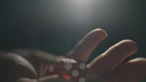 Slow motion close-up red dice shaken in hand 库存影片 335699905