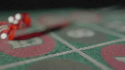 Slow motion close-up red dice thrown on table Stock Footage 335699927