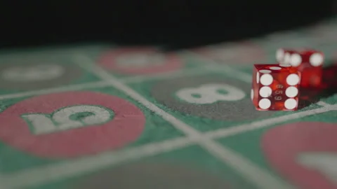 Slow motion close-up red dice on gaming table Stock Footage 335699928