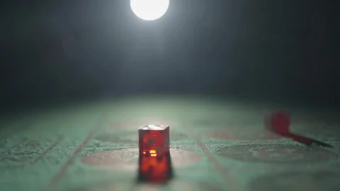 Slow motion close-up red dice on felt gaming table Stock Footage 335699947