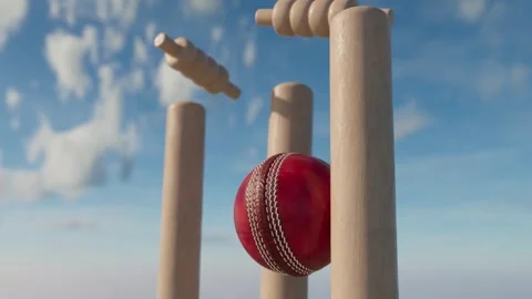 A slow motion close up of a red leather stitched cricket ball hitting wickets Stock Footage 245135563