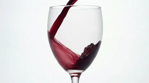 Slow motion close up of red wine pouring into a glass. Stock Footage 34666200