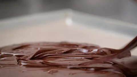 Slow Motion Close-up of Rich Melted Chocolate Ganache Pouring Over Dessert Pie Stock Footage 337751616