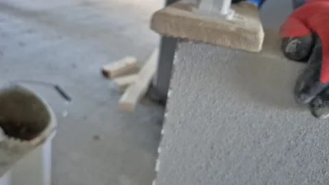 Slow Motion Close-up of Sanding AAC Block Surface with Dust Flying 库存影片 333984329