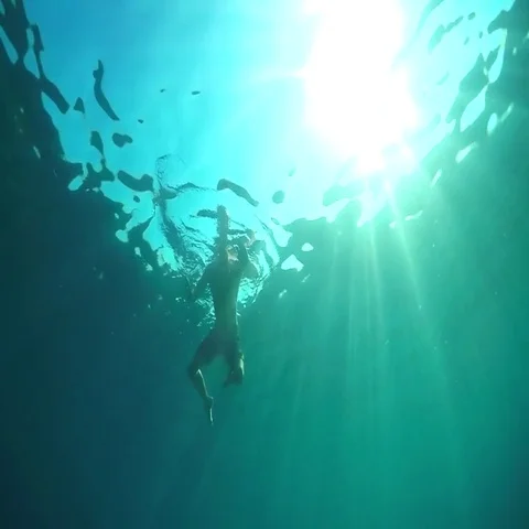 SLOW MOTION, CLOSE UP: Scared swimmer trying to escape from shark attacking him Video stock 69547053