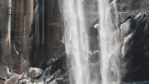 Slow motion close shot of the base of vernal falls on a winter day in yosemite Stock Footage 136924503