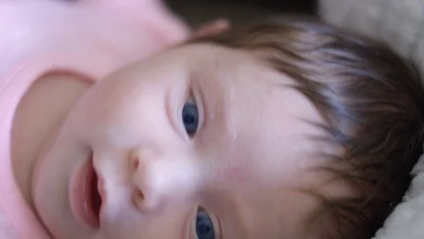 Slow motion close-up shot of a beautiful baby Stock Footage 107617427