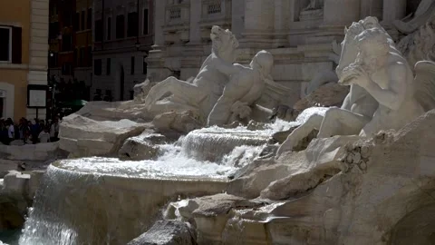 A slow motion close up shot of the cascading water of the Trevi Fountain Stock Footage 246797285