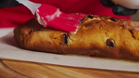 Slow motion close up shot of chef brushing melting butter on baked whole wheat Video stock 149330519