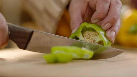 Slow Motion Close Up Shot of Cutting Vegetables Stock Footage 121829716