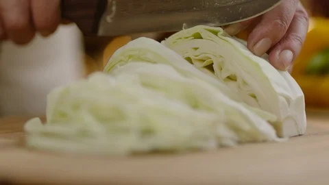 Slow Motion Close Up Shot of Cutting Vegetables Stock Footage 121829720