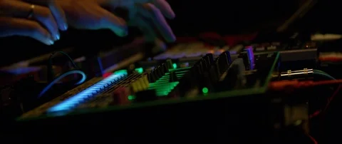 Slow motion close up shot of DJ's hands above mixer table at rave party, Japan Video stock 128970435