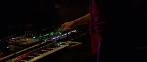 Slow motion close up shot of DJ's hands above mixer table at rave party, Japan Stock Footage 128970739