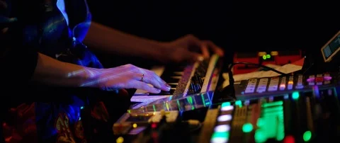 Slow motion close up shot of DJ's hands above mixer table at rave party, Japan Video stock 128975778