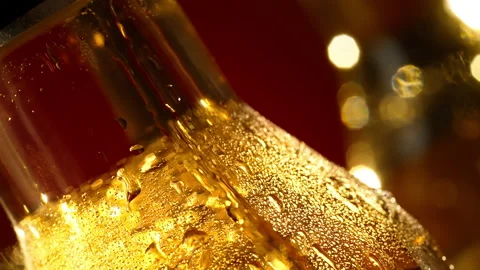 Slow motion close up shot of a drop running down a bottle Stock Footage 148158176