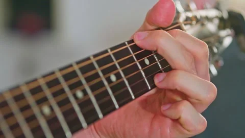 Slow motion close up shot of guitar playing Stock Footage 255128705