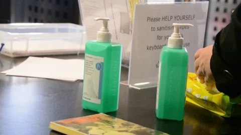 Slow motion, Close shot of hands using cleaning wipes, University of London Stock Footage 126299402
