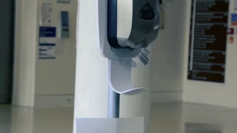 Slow motion, close shot of hands taking gel sanitizer from dispenser Stock Footage 131543781