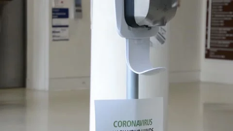Slow motion, close shot of hands taking gel sanitizer from dispenser Stock Footage 131543803