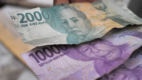 Slow motion close up shot of Indonesian Rupiah, rupiahs paper bills. Stock Footage 239718599