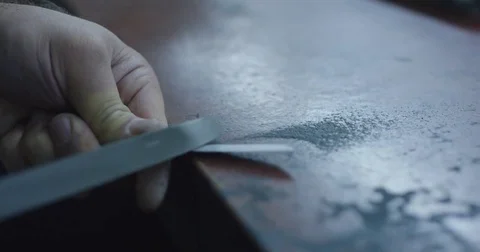 Slow motion close up shot of knife being sharpened. Stock Footage 71931073