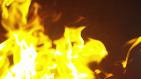 Slow motion close up shot of large flame burning outdoors during night Stock Footage 208761916