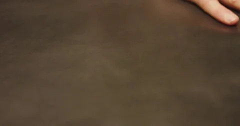 Slow motion close up shot of mans hand over shoe leather. Stock Footage 71915844