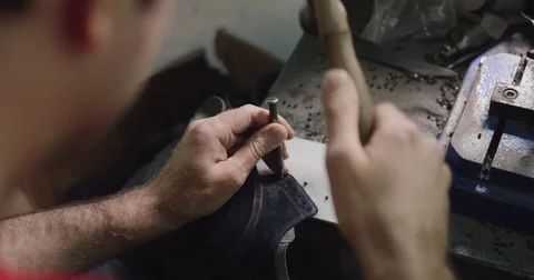 Slow motion close up shot of shoe making by hand. Video stock 71934024