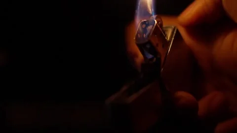SLOW MOTION CLOSE UP SHOT OF A ZIPPO STYLE LIGHTER TURNING ON WITH A BIG FLAME Stock Footage 321791090