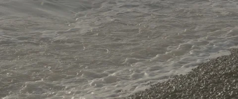 Slow Motion Close-Up of Single Wave Crashing on Suffolk Shingle Beach Stock-Footage 320114802