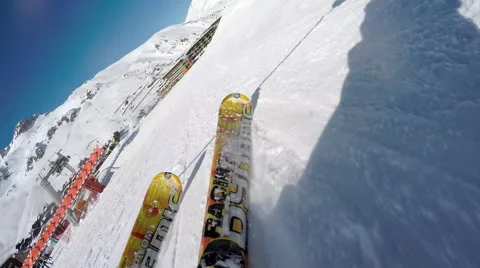 Slow motion close-up of skis carving across ski slope 動画素材 66475210