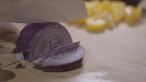 Slow Motion Close up of Slicing Red Onion Stock Footage 128993633