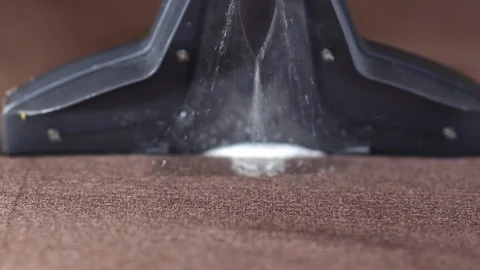 Slow motion close-up special brush sucks dirt out of sofa Stock Footage 122075202
