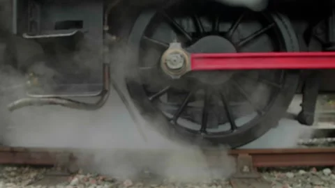 Slow motion close up of steam coming out of old train wheel 4k Stock Footage 249391255