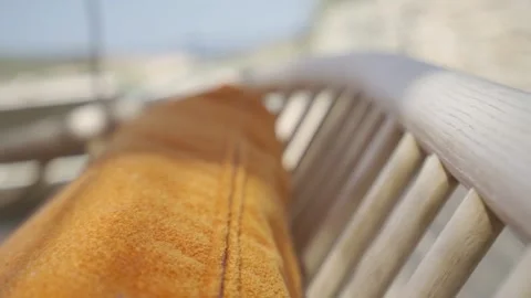 Slow motion close up of a swing bed and pillow with moving light and shadow  Stock Footage 257949854