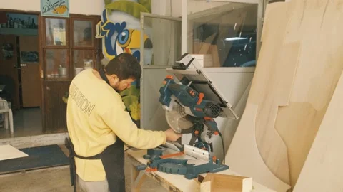 Slow Motion Close Up of Table Saw Cutting Wood on Construction Site Stock Footage 167708532