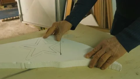 Slow Motion Close Up of Table Saw Cutting white styrofoam plastic star Stock Footage 167709475