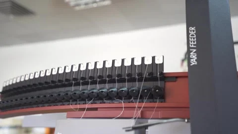 Slow motion close up of a thread being passed through a thread tester Stock Footage 257763289