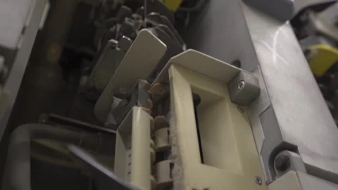 Slow motion close up of a thread passing through a spinning mill machine Stock Footage 257762091