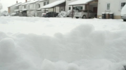 SLOW MOTION, CLOSE UP: Throwing fresh soft snow away with one shovel swing Stock Footage 68588761