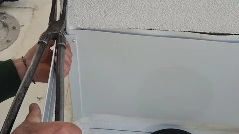 Slow Motion Close-up of Tinsmith Shaping Metal Roof Flashing Stock Footage 334062178