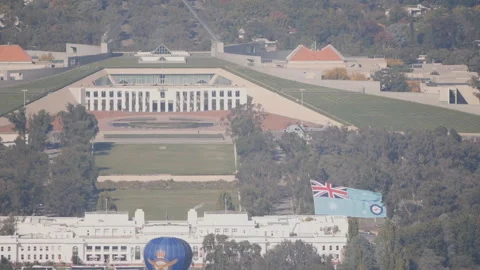 Slow motion close tracking shot of a helicopter carrying the raaf flag Stock Footage 152602279