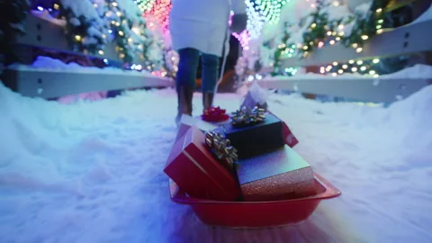 Slow motion close up tracking shot sled full of colorful Christmas gift boxes Stock-Footage 202096309