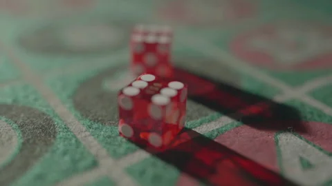 Slow motion close-up translucent dices on 11 with rack focus Vídeos de archivo 335699967
