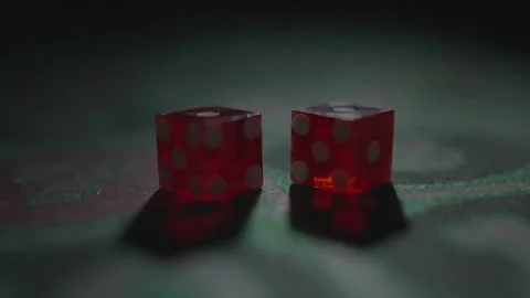 Slow motion close-up translucent red dice on table 库存影片 335699977