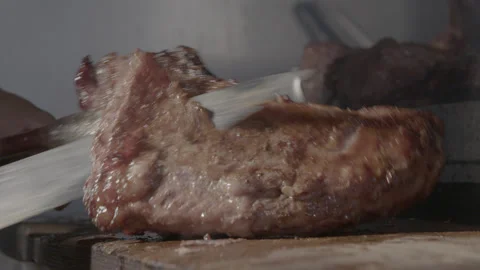 Slow Motion Close-Up Tri-Tip Steak Being Sliced Stock Footage 316719118