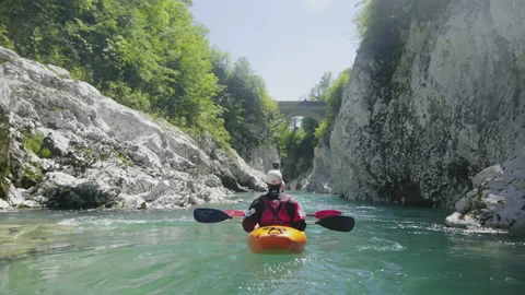Slow motion close up two people kayaking in dual kayak on emerald whitewater Stock Footage 132027565