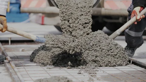 SLOW MOTION, CLOSE UP: Two unrecognizable workers cover a sewage pipeline with Stock Footage 152021614