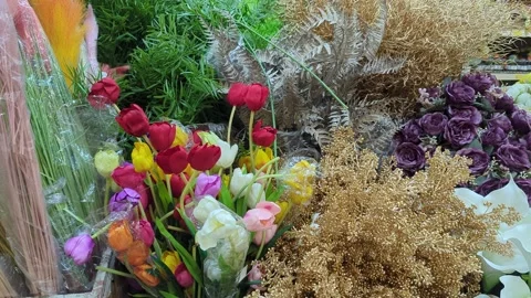 Slow Motion Close-up of Vibrant Artificial Flower Arrangement and Silk Bouquets Stock Footage 328824124